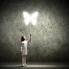 Image of little cute girl holding butterfly balloon