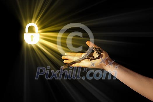 Close-up of human hand holding key. Idea concept Close-up of human hand holding key. Idea concept