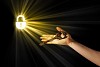 Close-up of human hand holding key. Idea concept