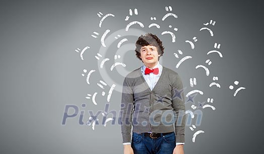 Image of young upset man in red tie crying Image of young upset man in red tie crying