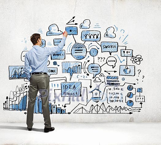 Back view image of businessman drawing sketches on wall Back view image of businessman drawing sketches on wall
