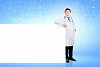 Young male doctor with blank banner. Place for text