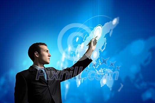 Image of young businessman touching icon of media screen Image of young businessman touching icon of media screen