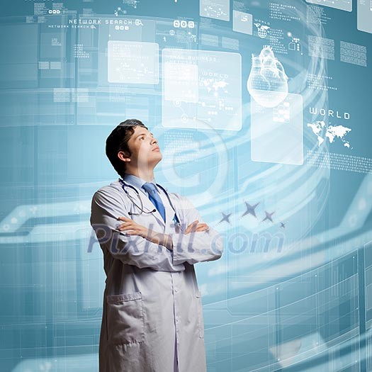 Young concentrated male doctor with arms crossed against digital background Young concentrated male doctor with arms crossed against digital background