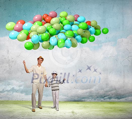 Image of father and son holding bunch of colorful balloons Image of father and son holding bunch of colorful balloons