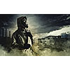 Man in gas mask against disaster background. Pollution concept