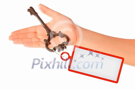 Image of key with blank label in human hand Image of key with blank label in human hand
