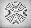 Round maze against white background. Solution idea