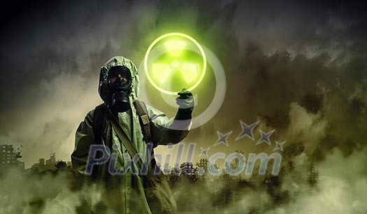 Man in respirator against nuclear background. Radioactivity concept Man in respirator against nuclear background. Radioactivity concept