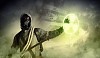 Image of man in gas mask and protective uniform touching radioactivity sign