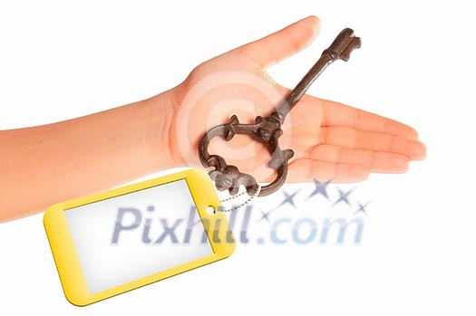 Image of key with blank label in human hand Image of key with blank label in human hand
