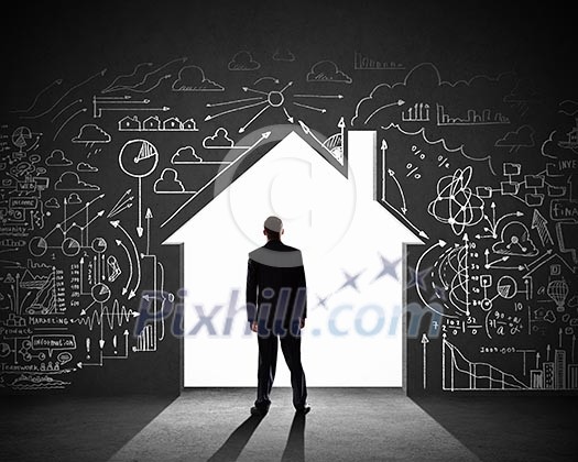 Silhouette of businessman against black wall. Construction concept Silhouette of businessman against black wall. Construction concept