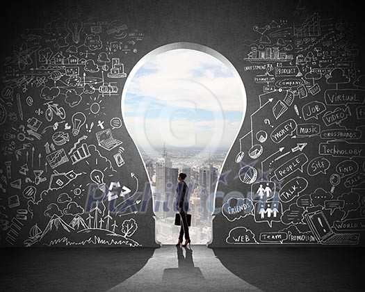 Silhouette of businesswoman against black wall with key hole Silhouette of businesswoman against black wall with key hole