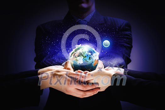 Close up image of human hands holding earth planer. Ecology concept Close up image of human hands holding earth planer. Ecology concept