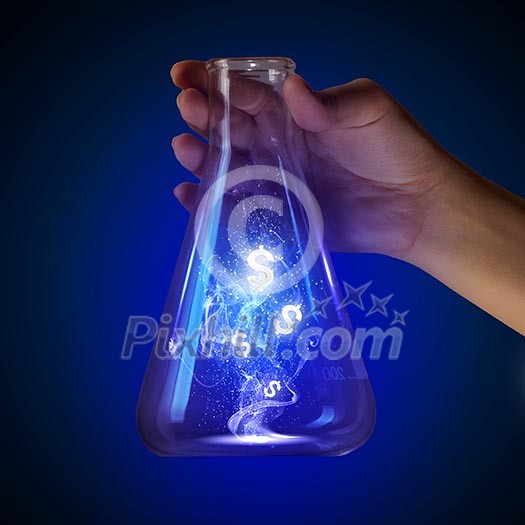 Close up image of human hand holding test tube. Money concept Close up image of human hand holding test tube. Money concept