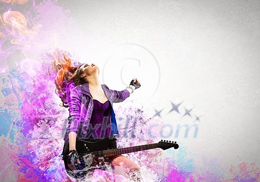 Young attractive rock girl playing the electric guitar Young attractive rock girl playing the electric guitar
