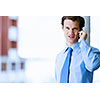 Image of handsome businessman speaking on mobile phone