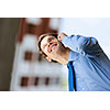 Image of handsome businessman speaking on mobile phone