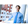Image of young handsome confident businessman in suit