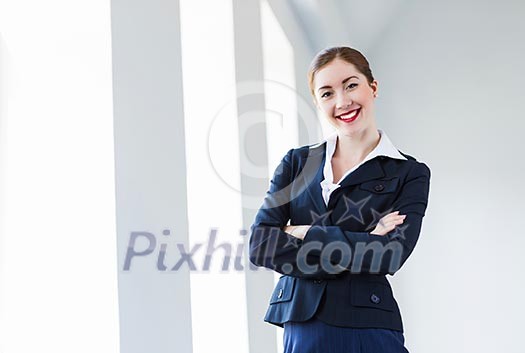 Image of young attractive businesswoman in business suit smiling Image of young attractive businesswoman in business suit smiling