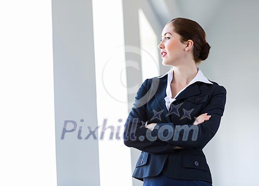 Image of young attractive businesswoman in business suit smiling Image of young attractive businesswoman in business suit smiling