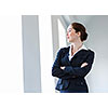 Image of young attractive businesswoman in business suit smiling