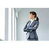 Image of young attractive businesswoman in business suit smiling
