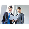 Young happy businessman and businesswoman people discussing project