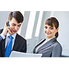 Young happy businessman and businesswoman people discussing project