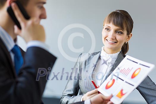 Young happy businessman and businesswoman people discussing project Young happy businessman and businesswoman people discussing project