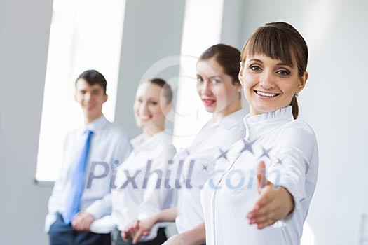 Image of four businesspeople standing in row. Partnership concept Image of four businesspeople standing in row. Partnership concept
