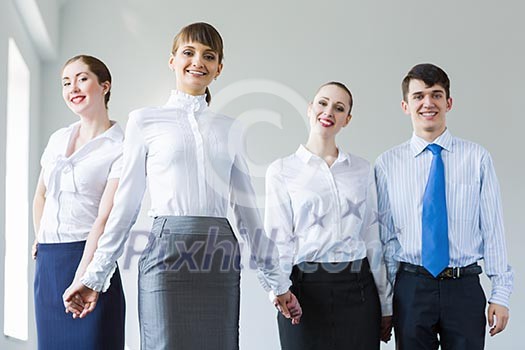 Image of four businesspeople standing in row. Partnership concept Image of four businesspeople standing in row. Partnership concept