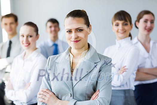 Young business people standing with arms crossed on chest