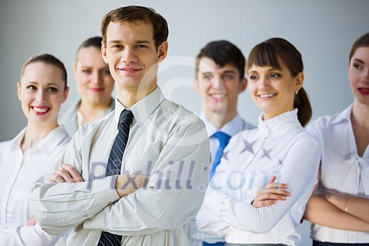 Young business people standing with arms crossed on chest Young business people standing with arms crossed on chest