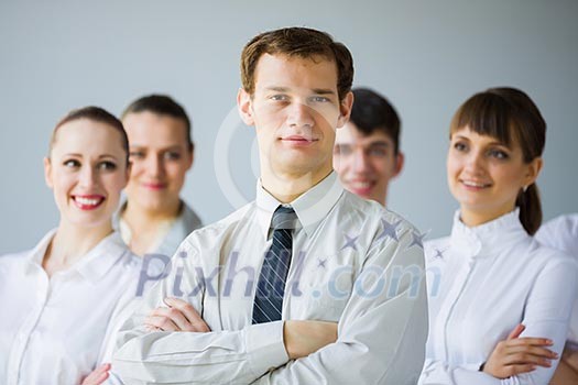 Young business people standing with arms crossed on chest Young business people standing with arms crossed on chest