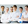 Young business people standing with arms crossed on chest