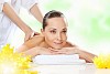 Young pretty woman with clear skin at spa salon getting massage