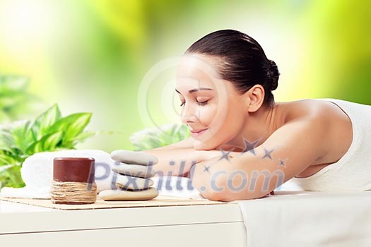 Young pretty woman with clear skin at spa salon getting massage Young pretty woman with clear skin at spa salon getting massage