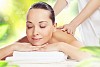 Young pretty woman with clear skin at spa salon getting massage