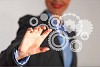 Image of businesswoman touching gear elements. Mechanism concept