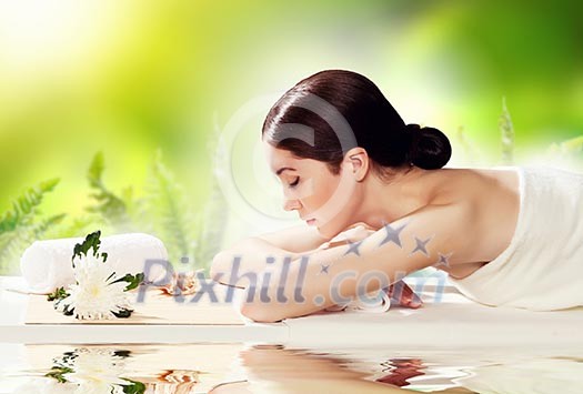 Young pretty woman with clear skin at spa salon getting massage Young pretty woman with clear skin at spa salon getting massage