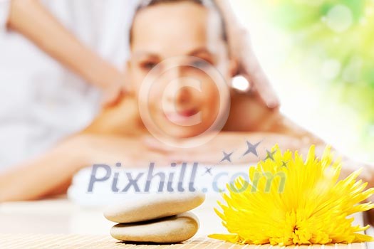 Young pretty woman with clear skin at spa salon getting massage Young pretty woman with clear skin at spa salon getting massage