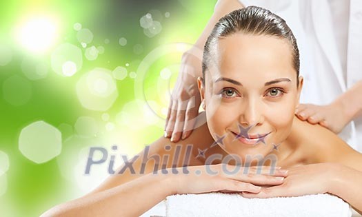 Young pretty woman with clear skin at spa salon getting massage Young pretty woman with clear skin at spa salon getting massage