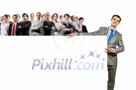 Image of young man holding blank banner with crowd of business people at background Image of young man holding blank banner with crowd of business people at background