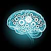 Human brain silhouette with gears and cog wheel elements against black background