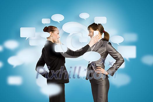 Two businesswomen talking on mobile phone. Cooperation concept Two businesswomen talking on mobile phone. Cooperation concept
