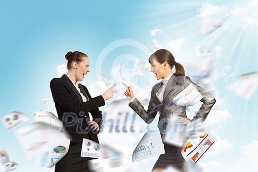 Image of two businesswomen in anger shouting at each other Image of two businesswomen in anger shouting at each other