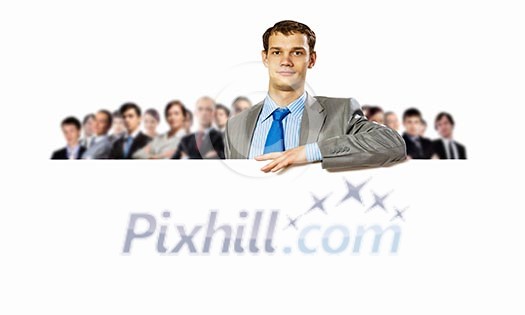 Image of young man holding blank banner with crowd of business people at background Image of young man holding blank banner with crowd of business people at background