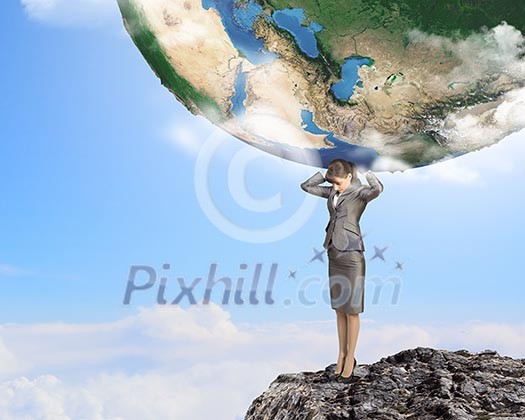 Image of businesswoman holding planet earth on shoulders Image of businesswoman holding planet earth on shoulders