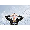 Image of irritated businesswoman in goggles with business collage at background